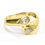An 18ct yellow gold two stone diamond ring, set with a pair of pear cut diamonds, size I, approx 2.