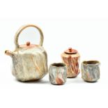 PASCAL GEOFFROY (born 1951); a stoneware teapot, caddy and pair of tea bowls covered in shino glaze,