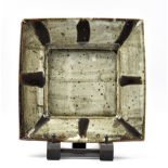 WILLIAM MARSHALL (1923-2007); a square stoneware tray, tenmoku decoration on speckled grey ground,
