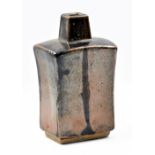 WILLIAM MARSHALL (1923-2007); a rectangular stoneware bottle with square neck covered in tenmoku