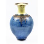 BRIDGET DRAKEFORD (born 1946); a porcelain bottle of bulbous form with cobalt and iron decoration to