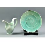 LEAH LEITSON; a porcelain jug and plate covered in celadon glaze, painted signature to plate, jug