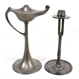 URANIA CONNELL; an Arts and Crafts pewter candlestick, the sconce raised on four claws and