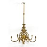 AFTER BENHAM & FROUD; an Aesthetic Movement brass five branch ceiling light, the central circular