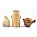 MASANOBU IZUMIHARA; a stoneware teapot covered in treacle glaze, and two anagama fired vases,