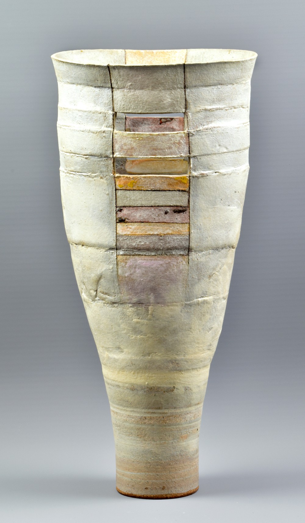 ROBIN WELCH (1936-2019); a tall tapered and pierced stoneware vessel, impressed RW mark, height