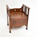AFTER WYLIE & LOCKHEAD; an Arts and Crafts carved oak seat with carved back and slatted sides