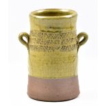 MATTHEW FOSTER for Leach Pottery; a lugged stoneware vessel partially covered in green ash glaze