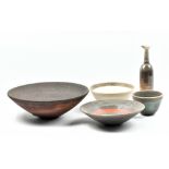 PHILIP CHAN; four raku bowls and a narrow necked bottle, sprigged PC marks and dated 1995-1998,