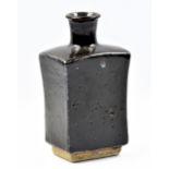 WILLIAM MARSHALL (1923-2007); a rectangular stoneware bottle with round neck covered in tenmoku