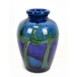 WILLIAM MOORCROFT; a 'Moonlit Blue' vase of shouldered cylindrical form with rolled neck, blue