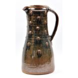 JIM MALONE (born 1946); a tall stoneware jug with finger dab decoration covered in tenmoku