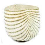 JOHN WARD (born 1938); a lobed stoneware vessel, mottled green geometric pattern on off white