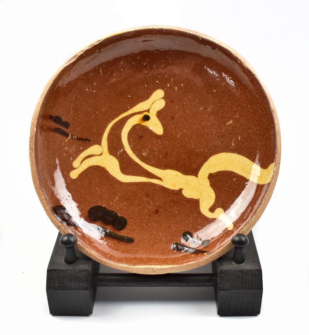 BERNARD LEACH (1887-1979) for Leach Pottery; a early slipware 'leaping deer' dish, impressed BL