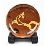 BERNARD LEACH (1887-1979) for Leach Pottery; a early slipware 'leaping deer' dish, impressed BL