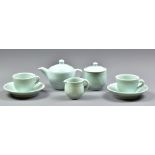 DEREK EMMS (1929-2004); a porcelain tea set covered in celadon glaze, comprising teapot, milk jug,