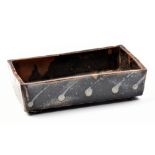 WILLIAM MARSHALL (1923-2007); a rectangular stoneware footed tray, kaki decoration on tenmoku