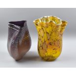 Two art glass vases, the purple example with ribbed detail, unsigned, height 28cm, the second with