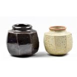 DAVID LLOYD JONES (1928-1994); a stoneware faceted vase covered in tenmoku breaking to kaki glaze