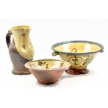 NIEK HOOGLAND (born 1953); a slipware colander, bowl and jug, impressed marks, colander diameter