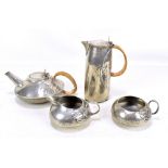 ARCHIBALD KNOX FOR TUDRIC PEWTER AND LIBERTY & CO; a four piece tea service, with planished and