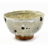 WILLIAM MARSHALL (1923-2007); a stoneware footed bowl, tenmoku trailed and spotted decoration on