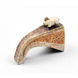 BLANDINE ANDERSON; a miniature stoneware sculpture of a sheep on a hill, impressed mark, height 5cm.