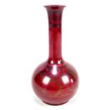 BERNARD MOORE; a flambé bottle vase, the lower body with floral decoration, signed and with HA and