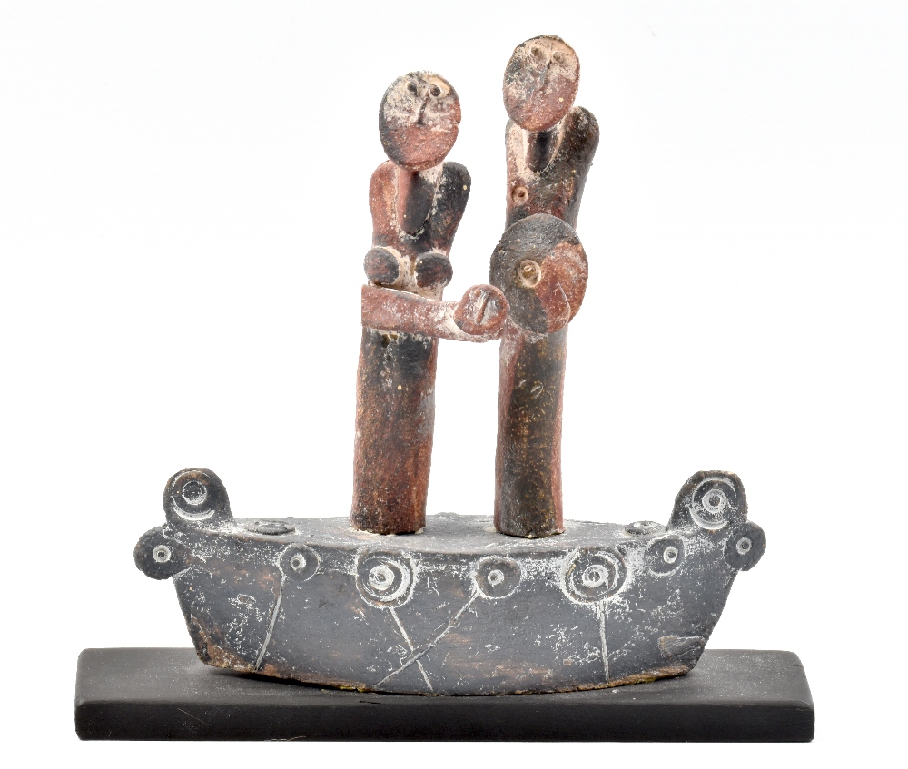 JOHN MALTBY (born 1936); a stoneware sculpture of a family group on a boat, mounted on wooden