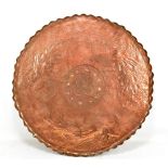 ATTRIBUTED TO FIVEMILETOWN; an Arts and Crafts copper charger of circular form, with piecrust edge