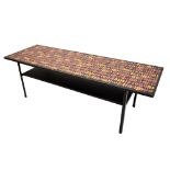 A rectangular coffee table, the top featuring printed design after John Piper, with under tier, 35.5