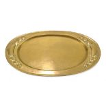 BELDRAY; an Arts and Crafts brass tray of oval form, relief decorated with Voysey-style panels,