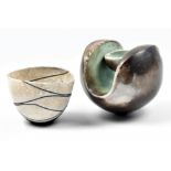 ANTONIA SALMON (born 1959); a stoneware holding form, burnished and smoke fired with sage green