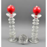 TIMO SARPANEVA FOR IITALA; a pair of 'Festivo' knopped and textured glass candlesticks, both with