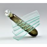 An unusual glass scent bottle, the cased smoked grey body set within four clear panes, with stopper,