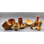 A group of American and other turned wooden bowls and vases, various makers and woods, tallest