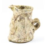 AKI MORIUCHI (born 1947); a stoneware jug covered in volcanic glaze, impressed mark, height 13.