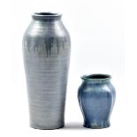 UPCHURCH POTTERY; a tall stoneware vase with pronounced ribbing covered in matte blue/grey glaze,