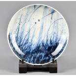 RICHARD HEELEY; a porcelain bowl with cobalt grasses and birds decoration, impressed RH and