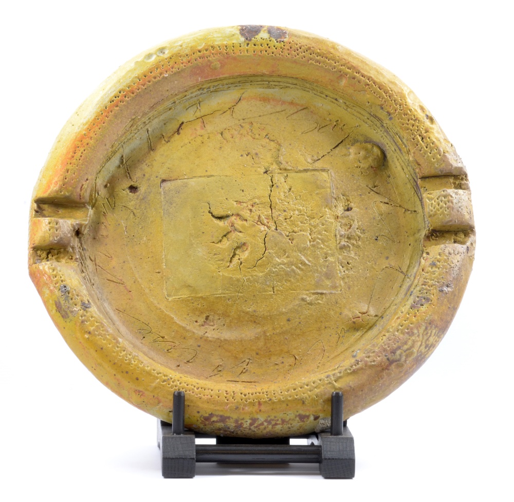 CHARLES BOUND (born 1939); a large stoneware platter covered in mustard glaze, wood-fired, impressed