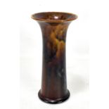 RUSKIN; a high fired trumpet vase, decorated with a brown mottled glaze, impressed marks and dated