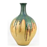 A very large stoneware bottle decorated with running blue/green glaze, painted mark, height 56.5cm.