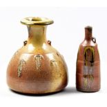 JOHN JELFS (born 1946); a lugged stoneware bottle covered in mottled tan glaze with incised