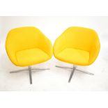 WALTER KNOLL; a pair of 'Turtle' chairs, on chrome supports, height 72cm.