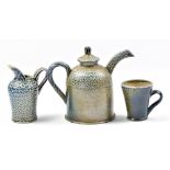 REBECCA HARVEY; a soda fired teapot, jug and cup, teapot height 14.5cm (3). (D)Additional