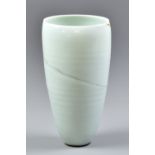 JOANNA CONSTANTINIDIS (1927-2000); a oval porcelain vase, pale celadon glaze with faint integral