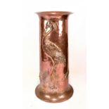 An Arts and Crafts copper stick stand, relief decorated with a heron, a fish, a frog and lily