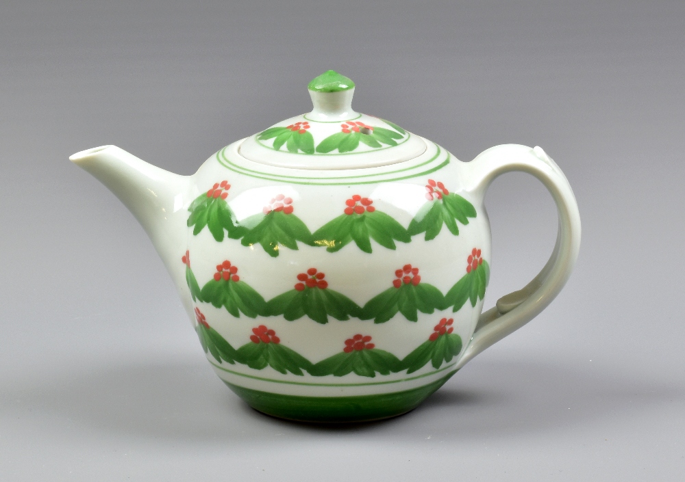 DEREK EMMS (1929-2004); a porcelain teapot decorated with red berries and green leaves on celadon