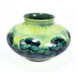 WILLIAM MOORCROFT FOR LIBERTY & CO; a 'Hazeldene' pattern squat circular vase, green signature and