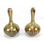 LINTHORPE; a pair of drip glazed bottle vases in the manner of Christopher Dresser, one bearing
